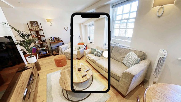 Matterport: a cellphone showing a room with couches and coffee table